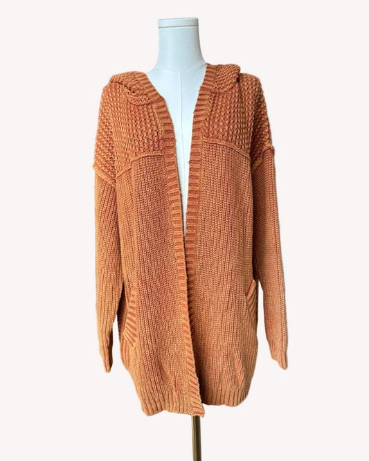 Washed 100% cotton hooded cardigan with a relaxed, cozy fit, shown in a soft neutral tone against a clean soft-linen background for an easy layered look.