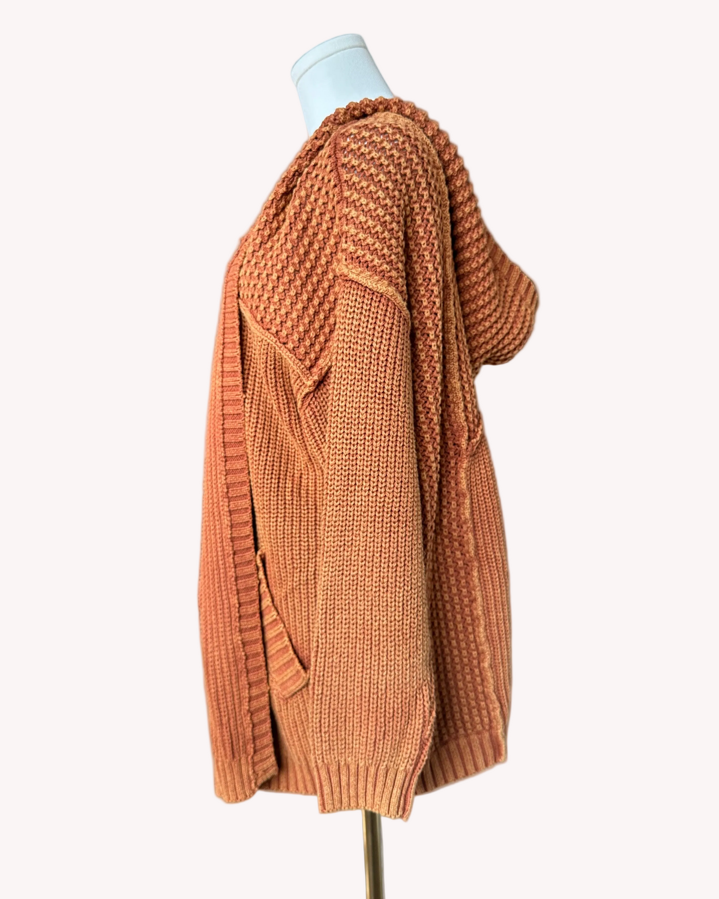 Washed 100% cotton hooded cardigan with a relaxed, cozy fit, shown in a soft neutral tone against a clean soft-linen background for an easy layered look.