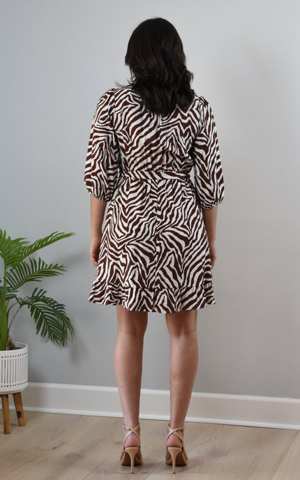Back view of Wild Grace zebra print dress with round neckline and soft drape