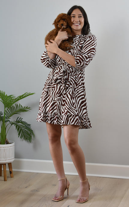 Wild Grace Zebra Tie Dress in ivory and brown print with round neckline and waist tie