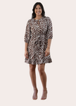 The Wild Grace Zebra Tie Dress in ivory and brown — round neckline, 3/4 sleeves, and adjustable waist tie from Justyna Grace Boutique.