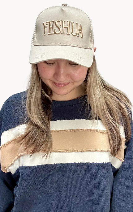 Yeshua puff embroidered hat in neutral tones, classic 5-panel cotton cap with raised lettering and snapback closure, photographed on a Soft Linen background for Justyna Grace Boutique.